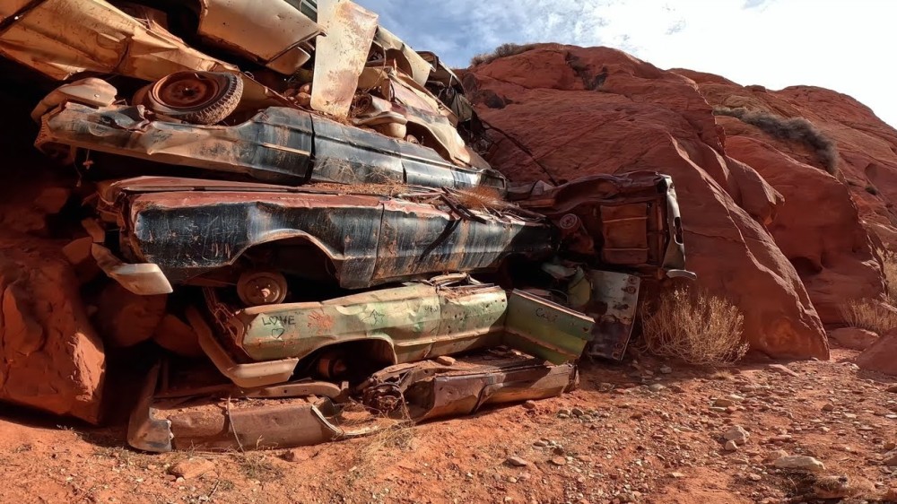 why there’s a wall of junk cars in a Utah canyon